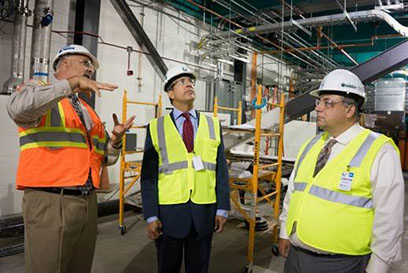 FRIB Conventional Facilities and Infrastructure Deputy Director Chris Thronson (left) gives a tour of the FRIB construction site to U.S. Representative Mike Bishop (center) and  MSU Vice President of Governmental Affairs Mark Burnham (right).