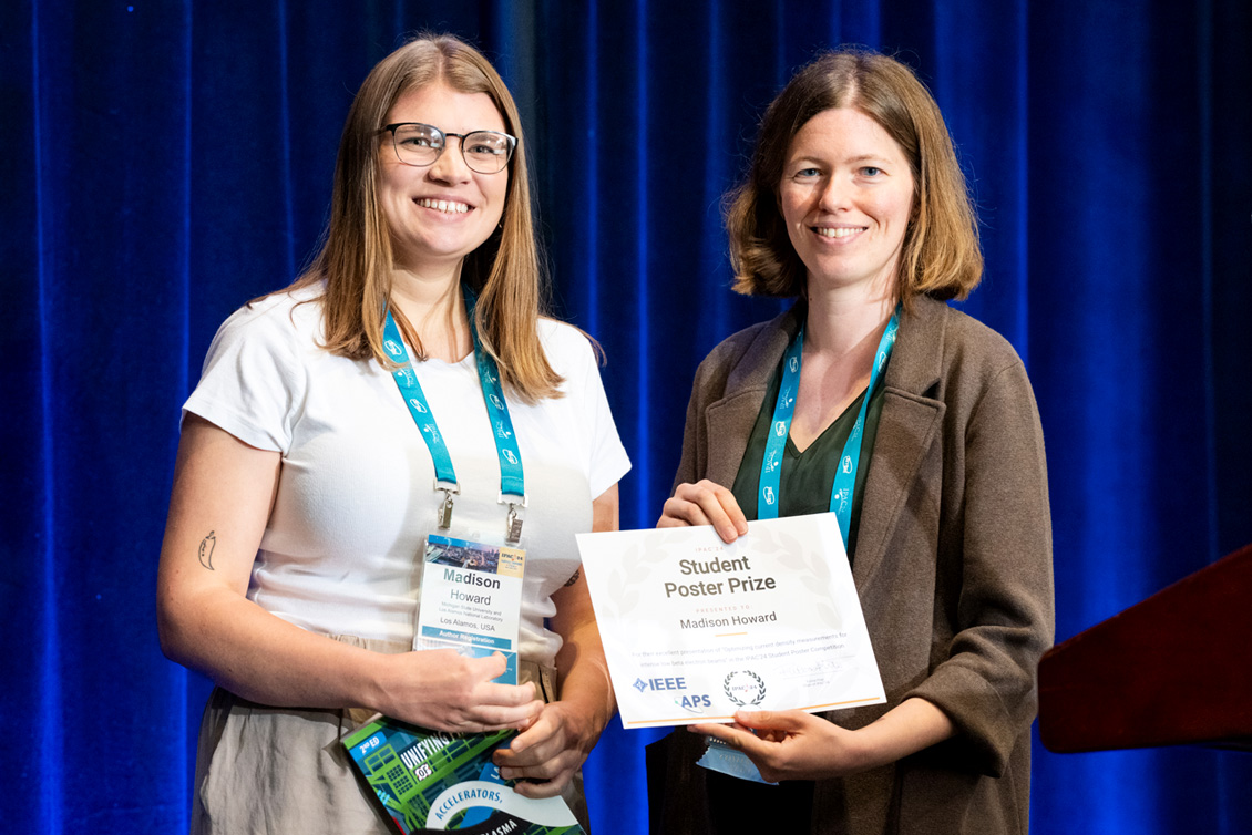 Picture of Madison Howard (left) receiving the “Best Student Poster” prize from Kiersten Ruisard (right) of Oak Ridge National Laboratory at the 2024 International Particle Accelerator Conference in Nashville, Tennessee.