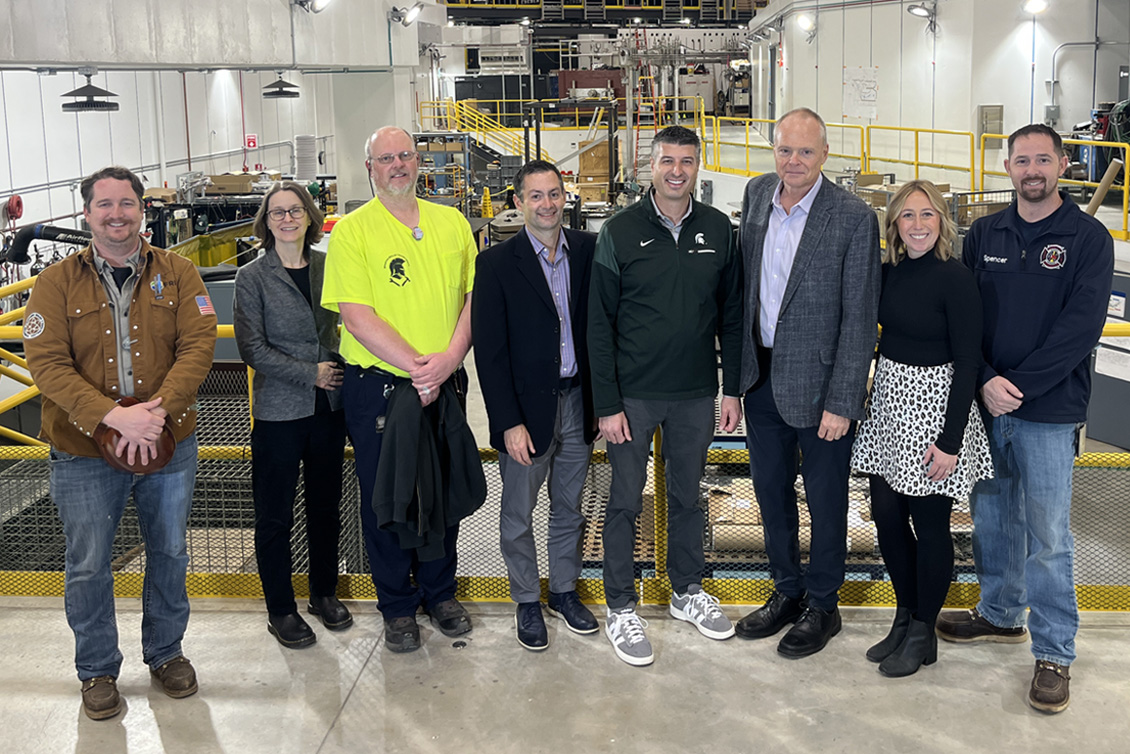A group photo featuring U.S. Representative Tom Barrett at FRIB