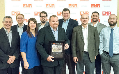 The Engineering News-Record Midwest recognized the FRIB Project in the Higher Education/Research category of its 2018 Best Projects award program. FRIB was awarded second place regionally, earning the Award of Merit. Pictured (from left to right): Michael Weingartz (SmithGroup), Michael Krug (SmithGroup), Jessica Kolp (FRIB), Kurt Cunningham (SmithGroup), Shelten Vieau (Barton Malow), Brad Bull (FRIB), Dan Yensch (SmithGroup), Bob Gallagher (Barton Malow), and Kevin Reseigh (Barton Malow).