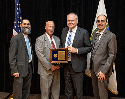 FRIB received the U.S. Department of Energy Office of Science (DOE-SC) Office of Project Assessment (OPA) Award for 2022 on 11 April 2023. Pictured, from left: DOE-SC Office of Nuclear Physics (NP) Nuclear Physics Major Initiatives Program Manager Ivan Graff, DOE-SC OPA Director Kurt Fisher, FRIB Project Director and now FRIB Laboratory Director Thomas Glasmacher, and DOE-SC NP Facilities & Project Management Division Director Paul Mantica. Mantica previously served as FRIB project manager and FRIB deputy laboratory director before entering government service.