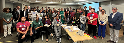 Participants of the Physicists Inspiring the Next Generation: Exploring the Nuclear Matter (PING) program gather for a group photo with several visiting representatives.
