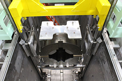Using a remote-handling crane, a magnet is lowered into place during repeatability testing.