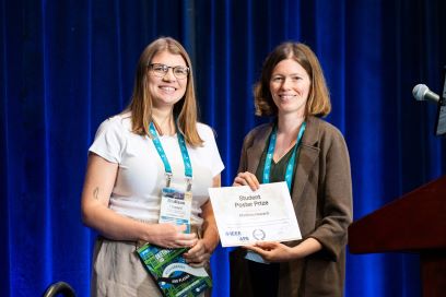 Picture of Madison Howard (left) receiving the “Best Student Poster” prize from Kiersten Ruisard (right) of Oak Ridge National Laboratory at the 2024 International Particle Accelerator Conference in Nashville, Tennessee.