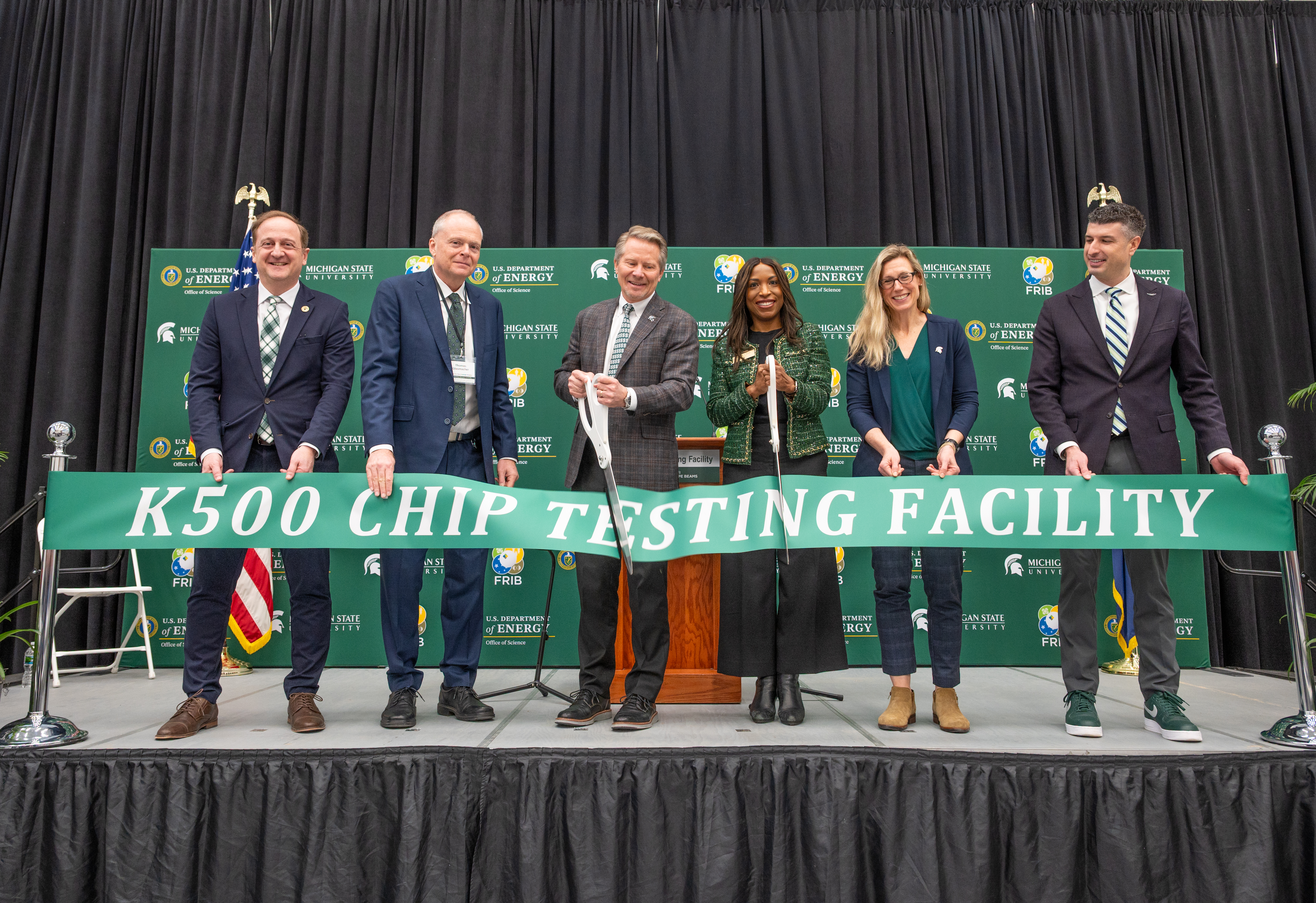 A photo of the K500 ribbon-cutting ceremony, showing several peop