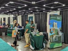 A photo of the FRIB booth at the 2023 National Diversity in STEM Conference (NDiSTEM) held in 26-28 October in Portland, Oregon.