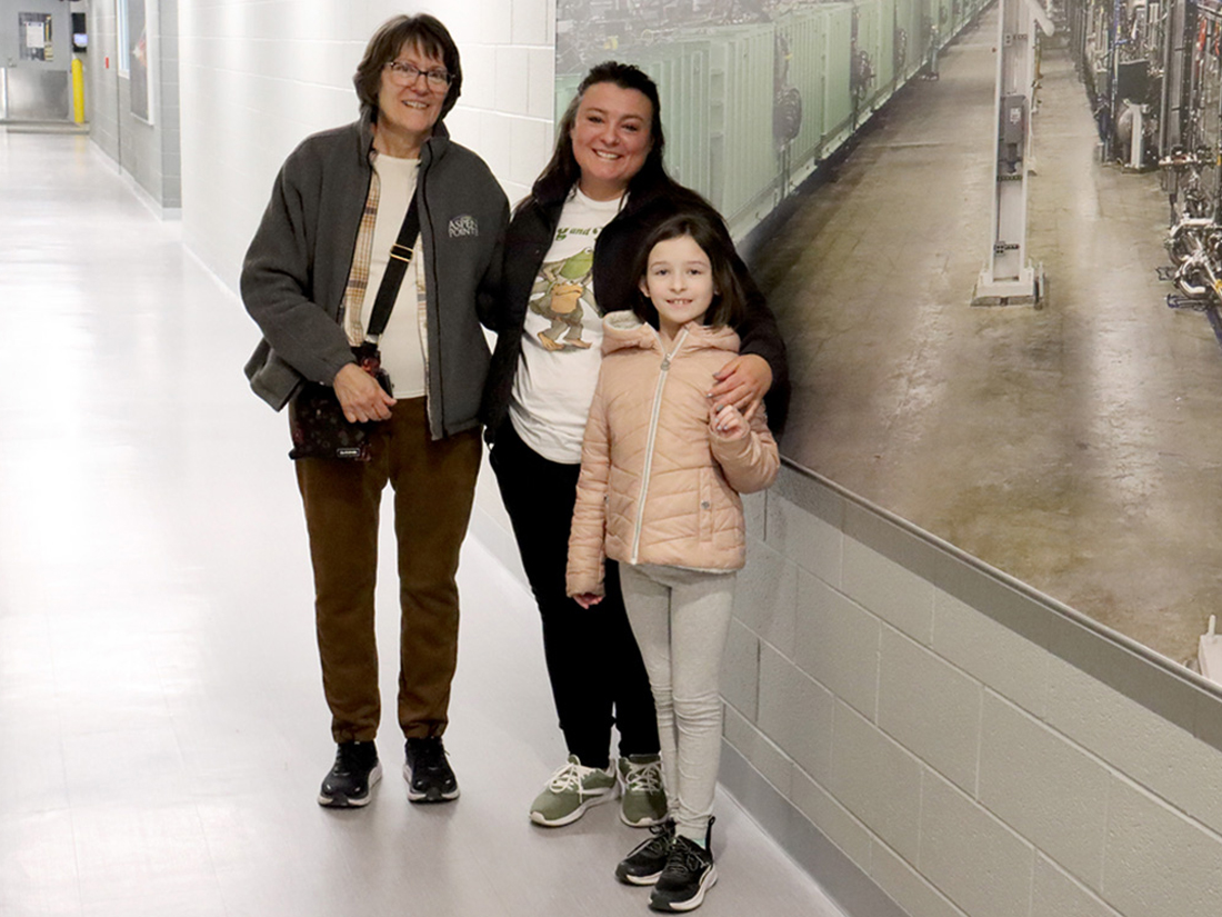 Tour group standing in FRIB hallway
